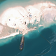 Illustration for article titled Incredible Satellite Images Show China Building Artificial Archipelago